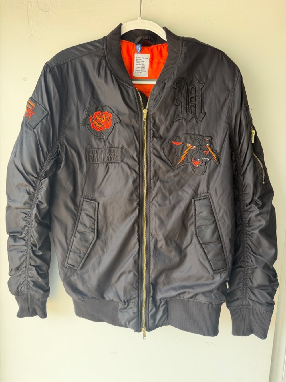Black Bomber Jacket with Orange Lining and Red Embroidered Accents